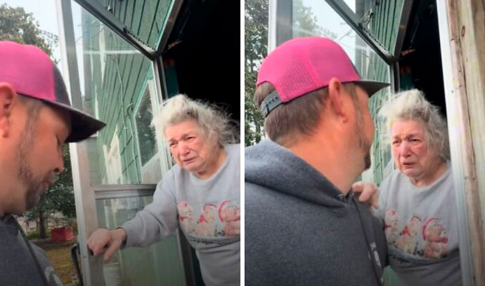 Man comforting elderly woman at front door with positive stories keyword