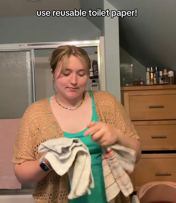 Woman showing reusable toilet paper hack for saving money Woman showing reusable toilet paper hack for saving money
