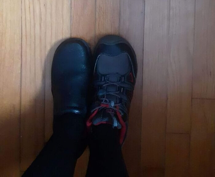 Mismatched shoes worn on feet showing a funny footwear fail