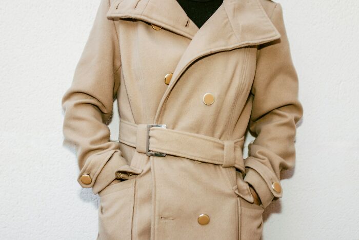 Person wearing a beige coat symbolizing confidence after ex cheating recovery