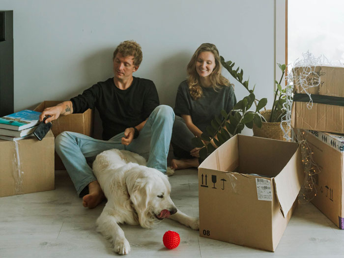 Couple and their dog among moving boxes; Karen shows up to stranger's home, son deserves it more. Couple and their dog among moving boxes; Karen shows up to stranger's home, son deserves it more.