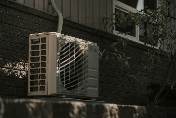 Outdoor air conditioning unit attached to house as American luxury