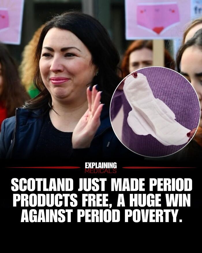 Woman smiling at event in Scotland supporting free period products initiative