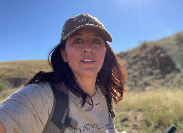 Scientist assistant hiking outdoors in casual gear Scientist assistant hiking outdoors in casual gear