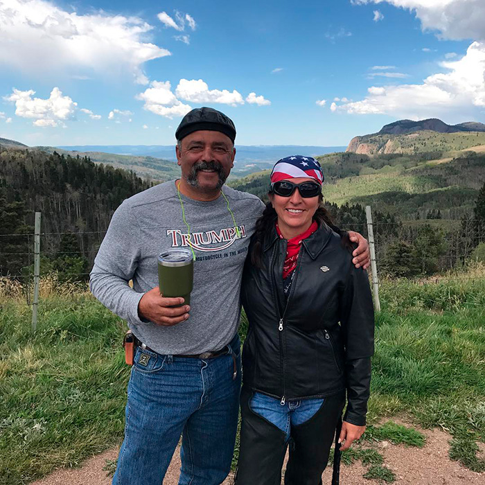 Couple posing outdoors on scenic mountain view with explosive new theories keyword Couple posing outdoors on scenic mountain view with explosive new theories keyword