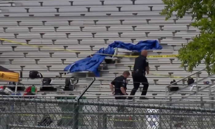 Police examine bleachers covered with blue tarp in Karmelo Anthony case