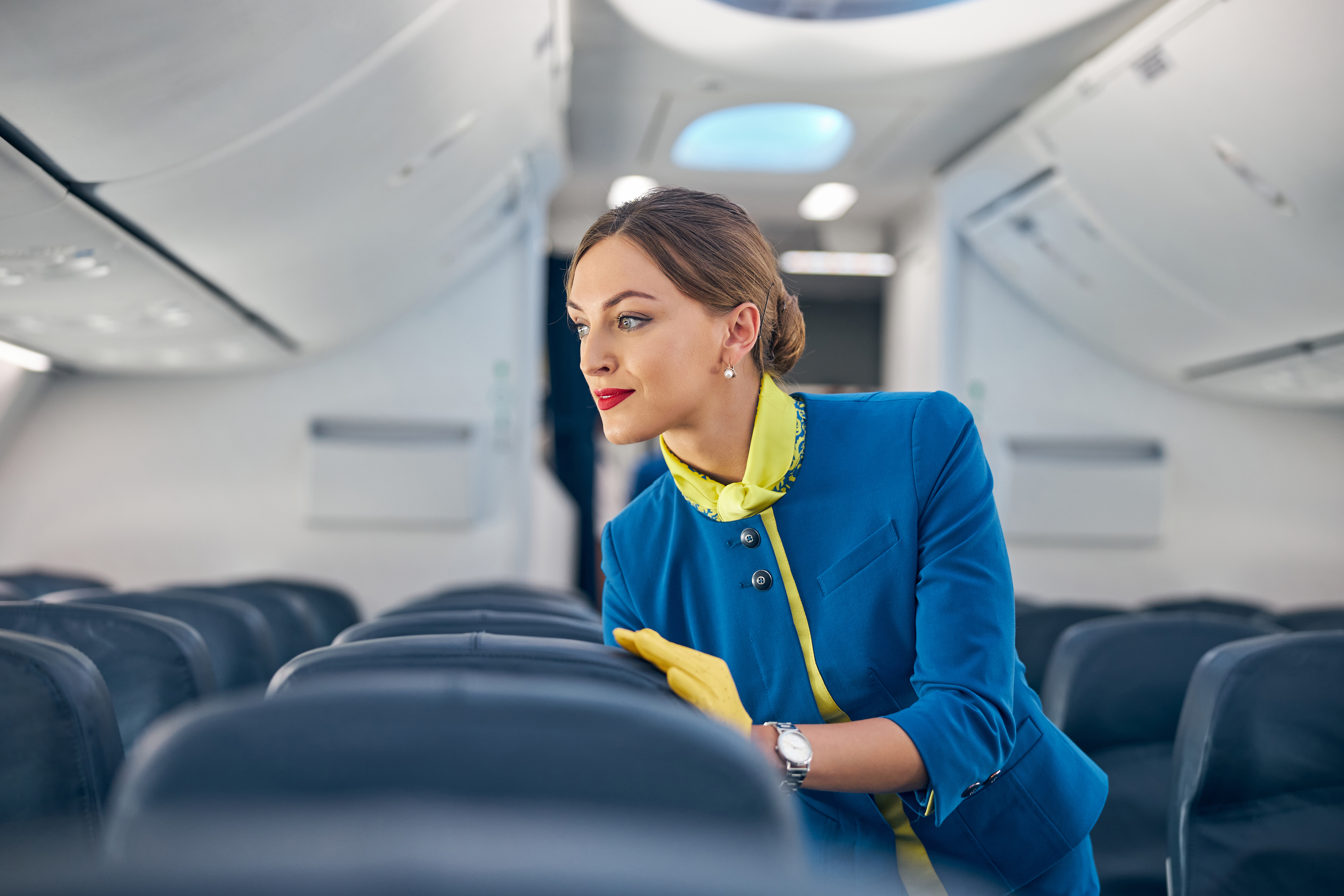 Flight attendant on an airplane after a shocking airport physical altercation at the airport. Flight attendant on an airplane after a shocking airport physical altercation at the airport.