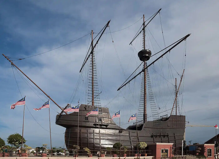 A large replica of an ancient wooden ship, evoking images of maritime history and lost treasures from the past.