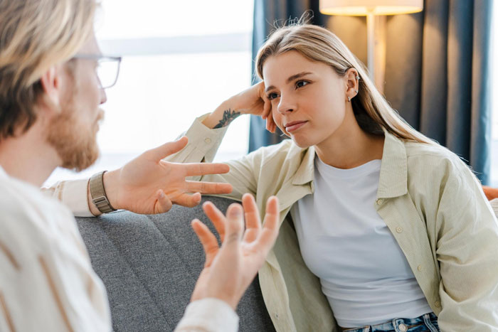 Young couple having serious conversation about relationship challenges Young couple having serious conversation about relationship challenges