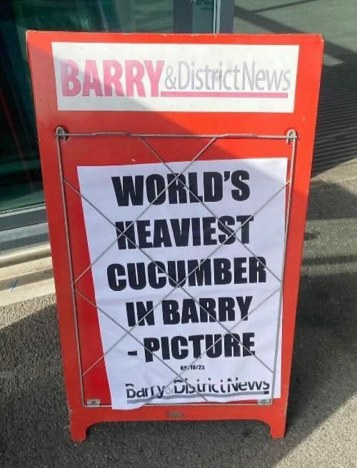 Barry newspaper sign about the world's heaviest cucumber in Barry