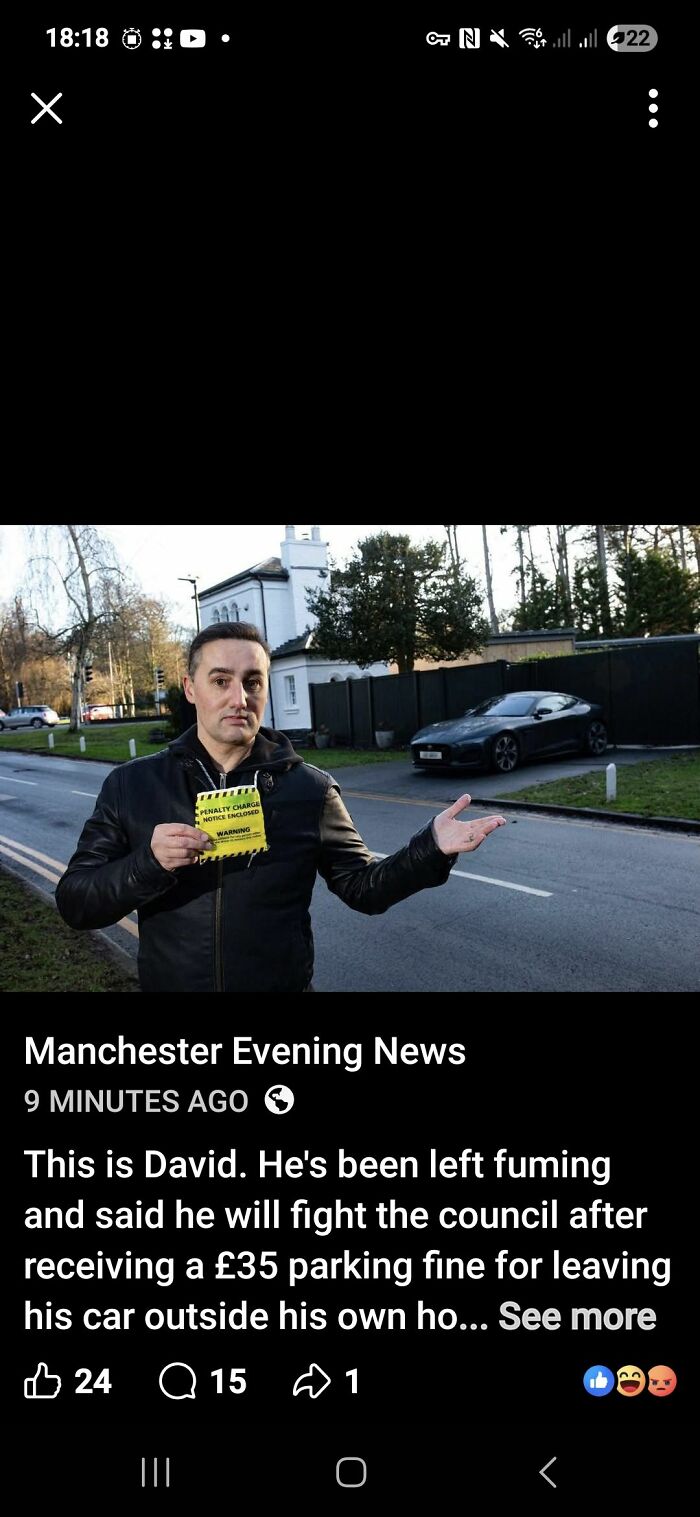 Man holding parking fine, upset about council's parking charge near his house