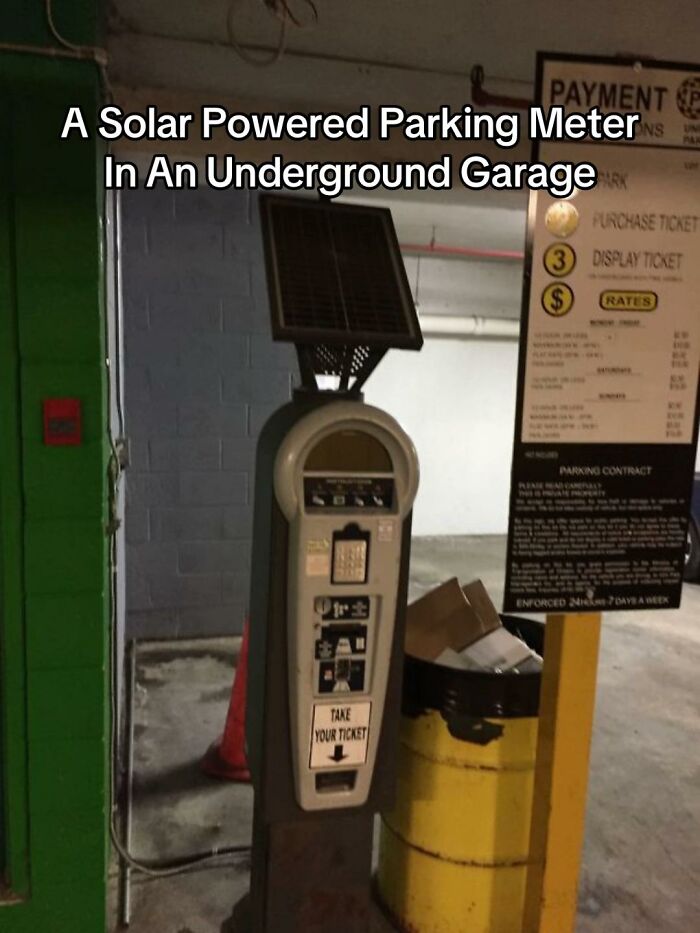 A solar-powered parking meter in an underground garage, demonstrating a bad design fail due to lack of sunlight.