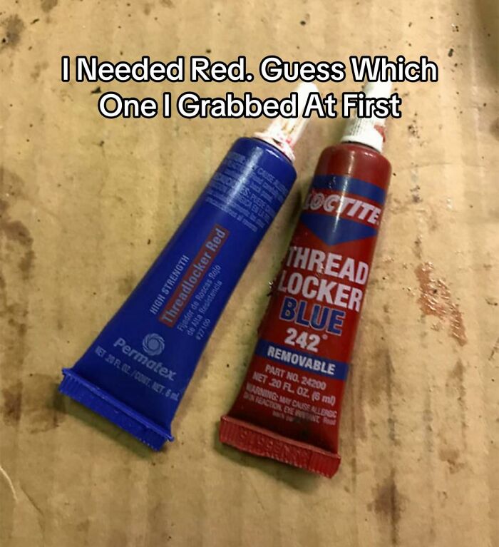 A hilariously bad design fail shows two tubes of threadlocker, one blue labeled Red and one red labeled Blue.