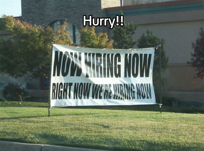 A white banner on a lawn reads NOW HIRING NOW RIGHT NOW WE'RE HIRING NOW, an example of a bad design fail.