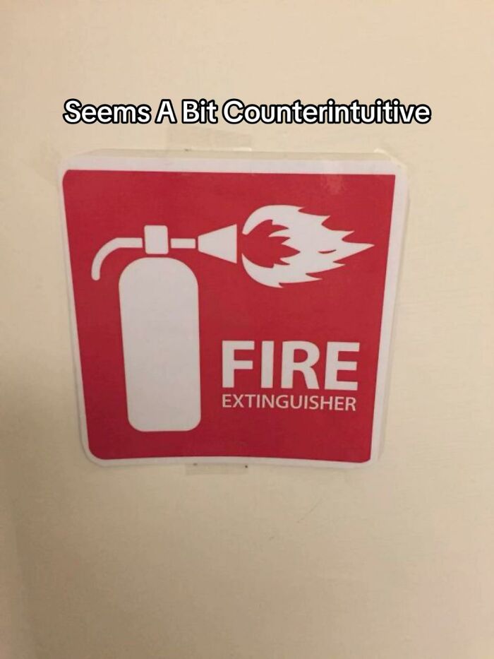 A fire extinguisher sign with a bad design fail, depicting a fire extinguisher actively spraying fire.