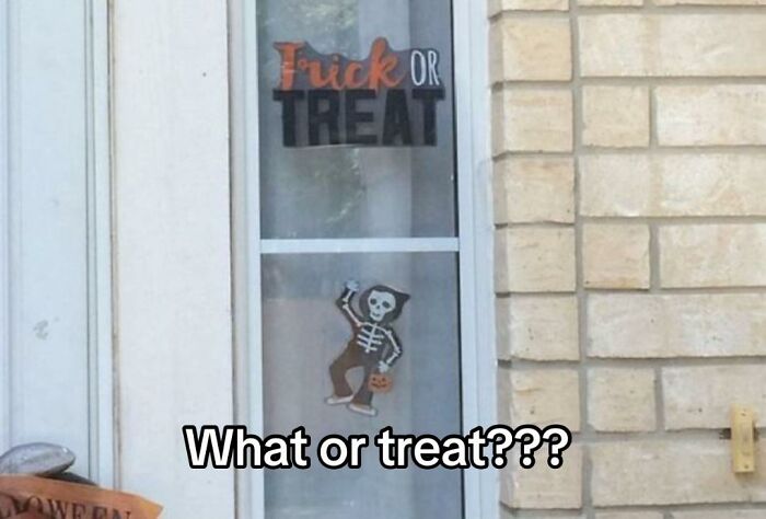 A hilariously bad design fail for a Halloween decoration, text on a window reads TRICK OR TREAT, but due to window frame placement it reads F***K OR TREAT.
