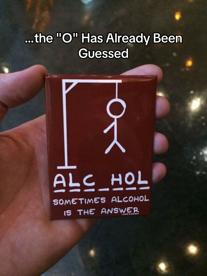 A hilariously bad design fail, a coaster with a hangman game for the word ALCOHOL, missing an O, with the text Sometimes alcohol is the answer.