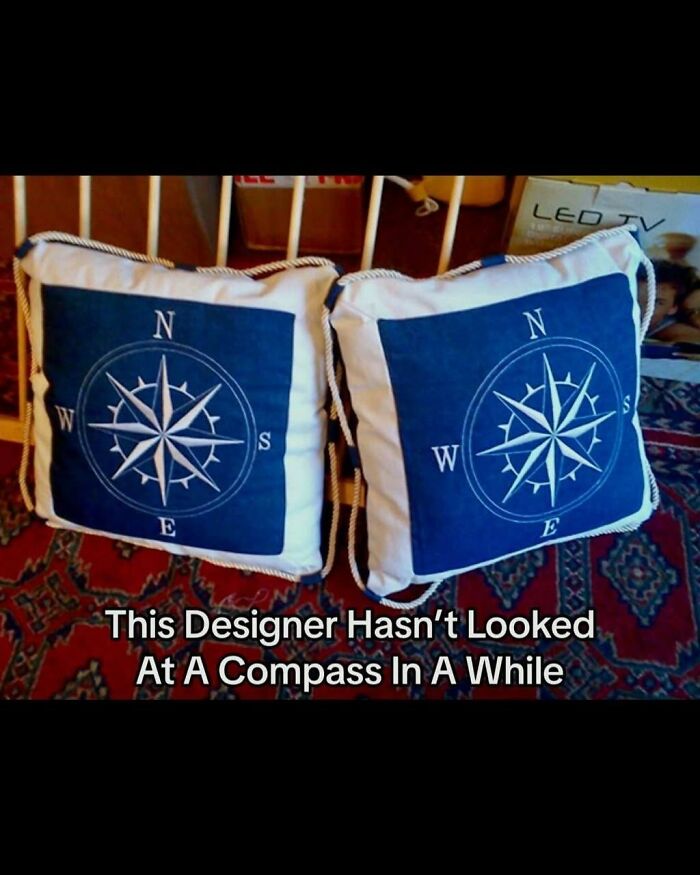 Cringeworthy design fail with compass pillows showing incorrect directions