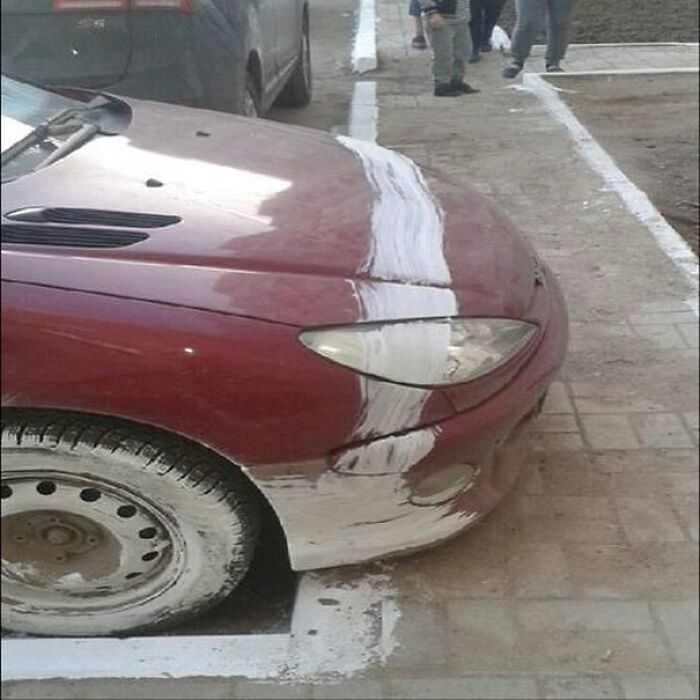 Car with white paint mimicking parking lines in design fail