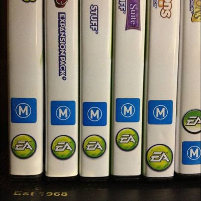 Misaligned video game cases with inconsistent EA logo placement