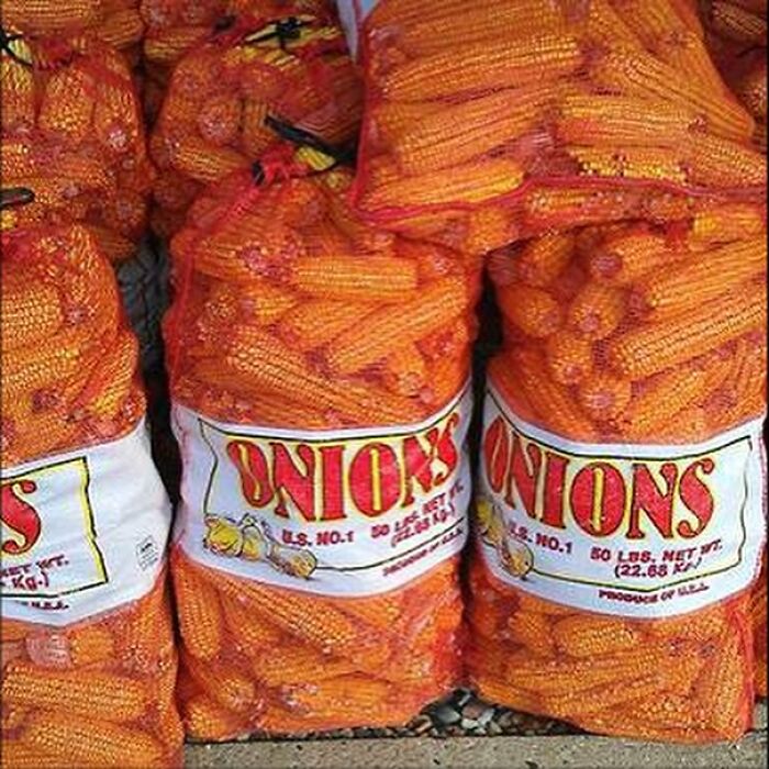 Bags labeled onions filled with corn cobs, showcasing a funny packaging fail