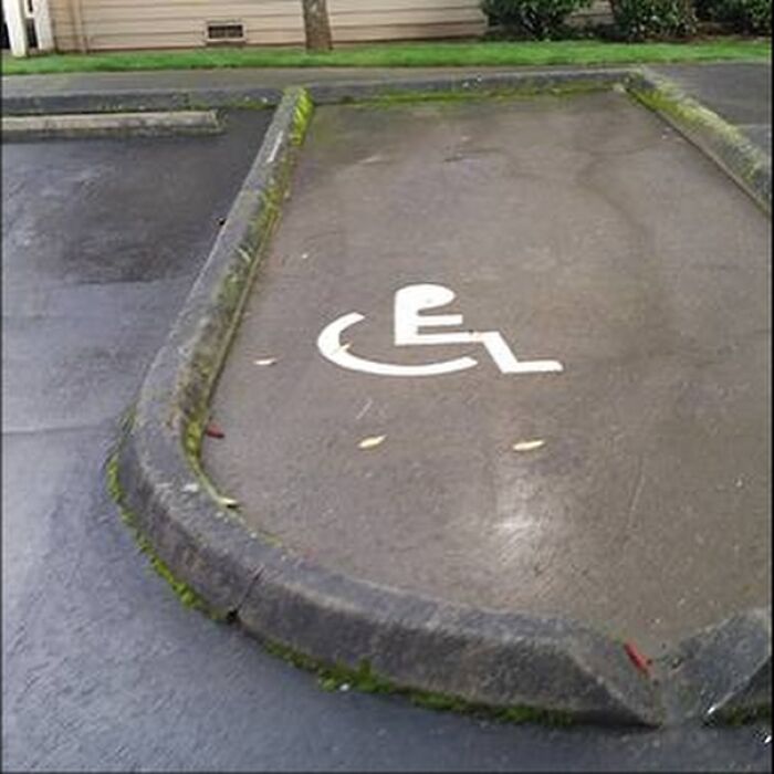 Handicap parking space with a curb blocking vehicle access – design fail