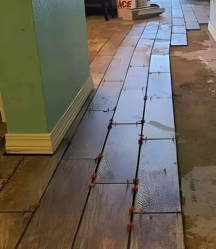 Cringeworthy design fail with warped and uneven floor tiles