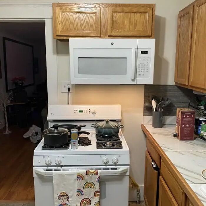 Kitchen design fail with microwave blocking stove light and space