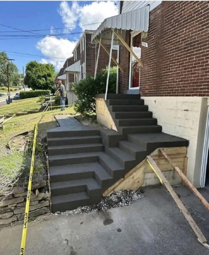 Outdoor concrete stairs with uneven and impractical design