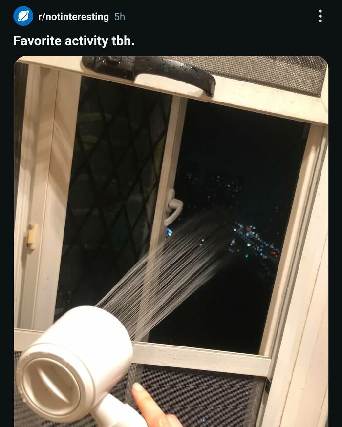 A funny image of someone spraying water out of a window at night. This broken humor post is one of 62 random posts.