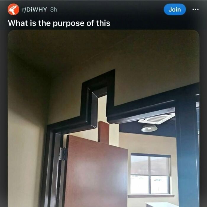 A funny, oddly constructed doorway with a zig-zag frame, raising questions about its purpose.