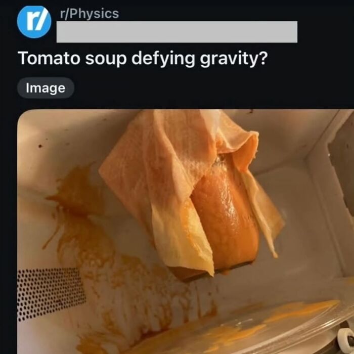 A funny image of tomato soup in a microwave, defying gravity and spilling, a broken humor moment.