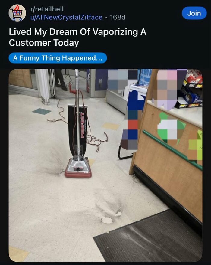 A commercial vacuum cleaner sits on a dirty floor in a retail store, making a funny observation.
