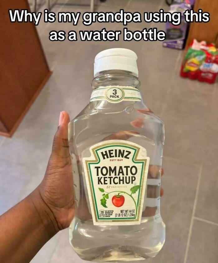 Ketchup bottle repurposed as water bottle labeled Heinz tomato ketchup