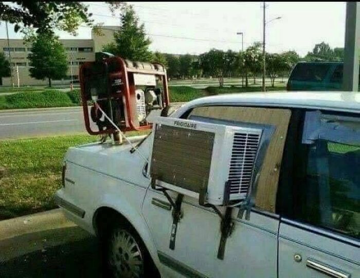 A car with a generator and an AC unit attached as an example of Slavic Science.