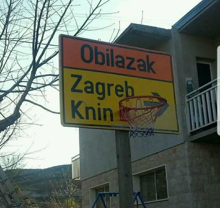 A street sign repurposed as a basketball hoop, an example of peculiar Slavic science and ingenuity.