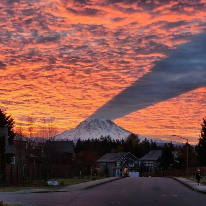 A great photo of a mountain at sunset, with a dramatic cloud shadow, an internet legend.