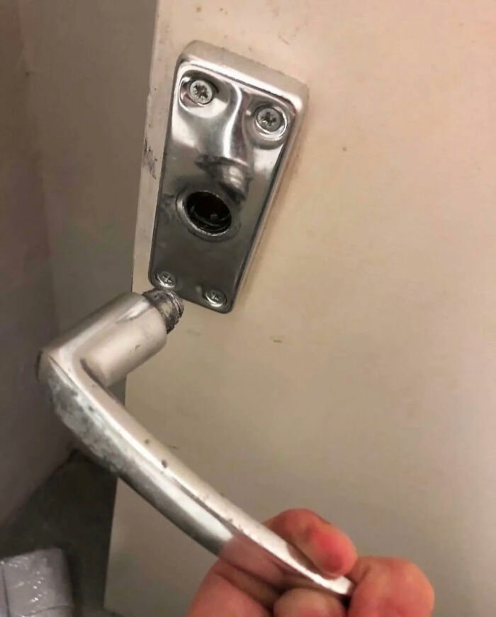 A broken door handle with the base resembling a face in distress, one of the great internet legends.