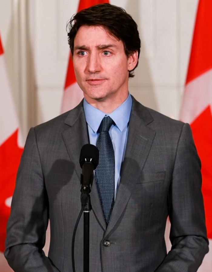 Justin Trudeau, a politician, is shown making a confession to Gavin Newsom at the World Cup in this image. Justin Trudeau, a politician, is shown making a confession to Gavin Newsom at the World Cup in this image.