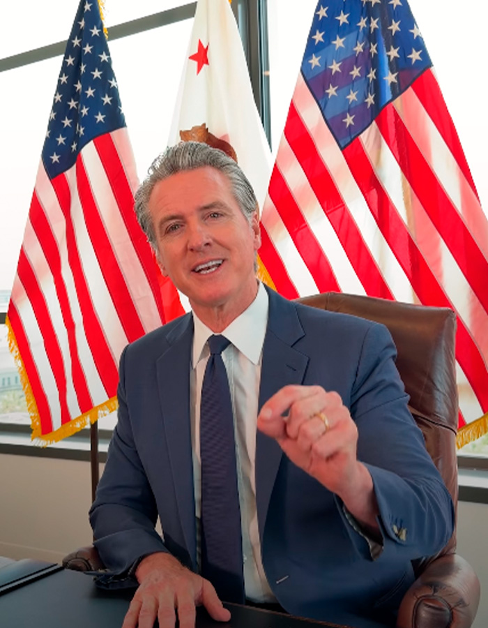 Gavin Newsom, a politician, makes a confession to Justin Trudeau at the World Cup, as seen in this image. Gavin Newsom, a politician, makes a confession to Justin Trudeau at the World Cup, as seen in this image.