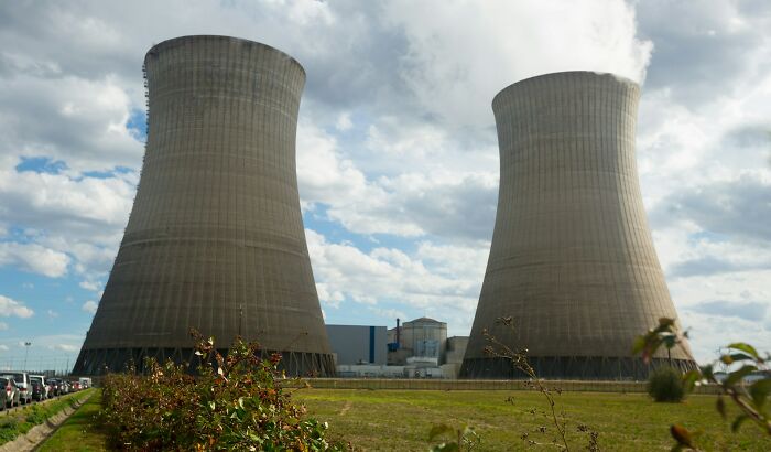 Two large cooling towers of a nuclear power plant, an unusual and imposing industrial landscape.