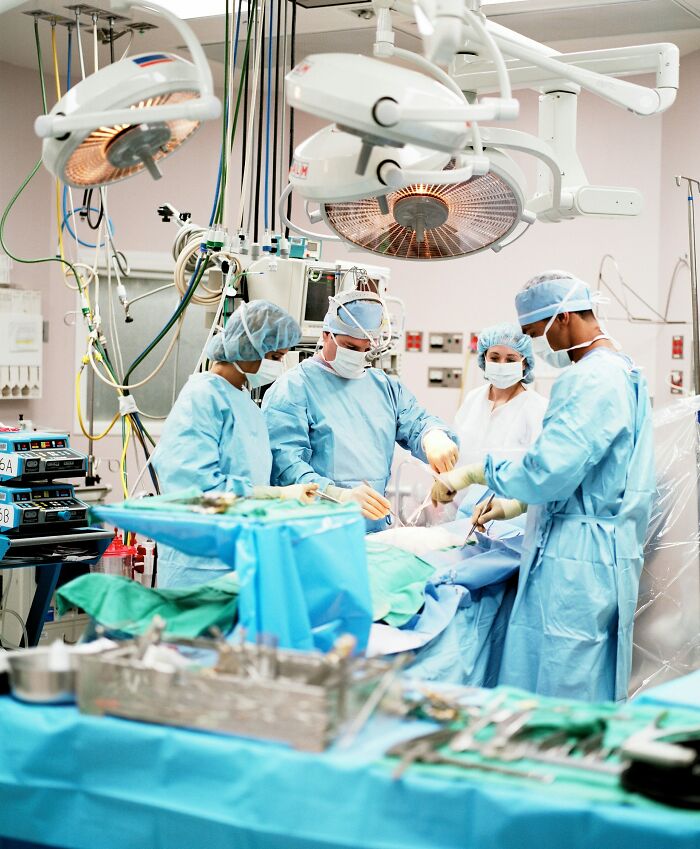 Medical team performing surgery in operating room