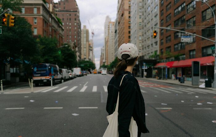 A woman in a New York City street, creating an awkward situation.