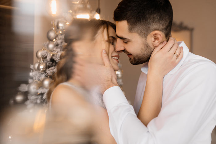 A happy couple, the groom and bride, sharing an intimate moment before the wedding.