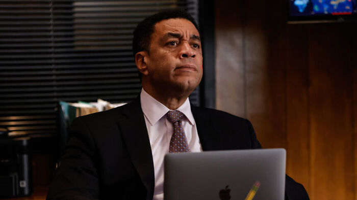 Guest star Alex Moffat in a professional setting for The Bear Season 5, looking contemplative.