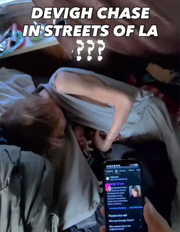 Video frame showing Daveigh Chase appearing to waste away on Skid Row, with text DEVIGH CHASE IN STREETS OF LA. Video frame showing Daveigh Chase appearing to waste away on Skid Row, with text DEVIGH CHASE IN STREETS OF LA.