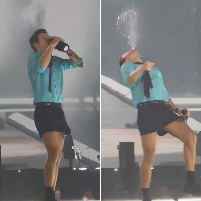Harry Styles choking on water and spitting it out onstage during a performance.