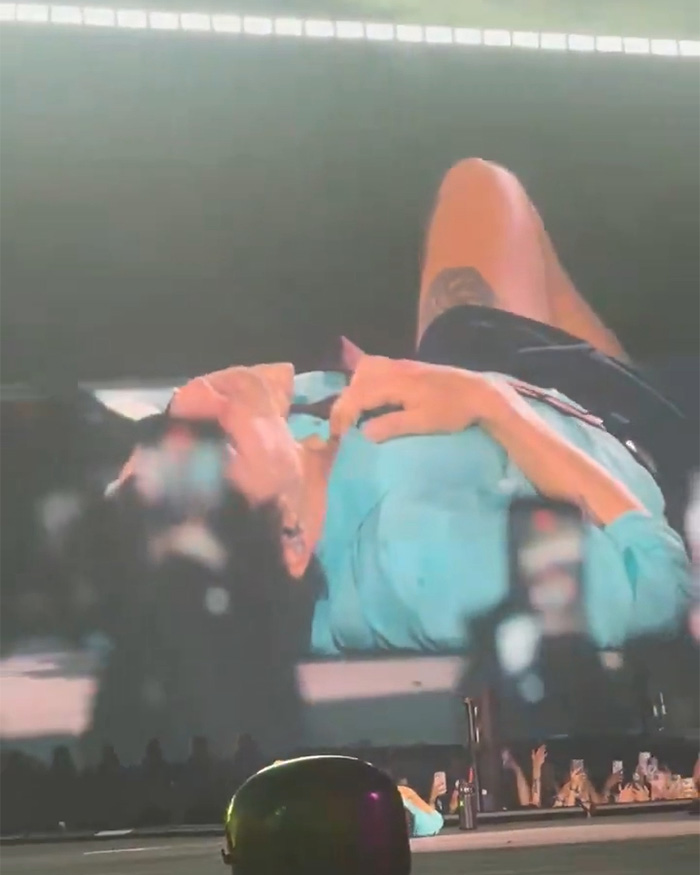 Harry Styles sparks concern, collapsing on stage during heatwave after choking on water.
