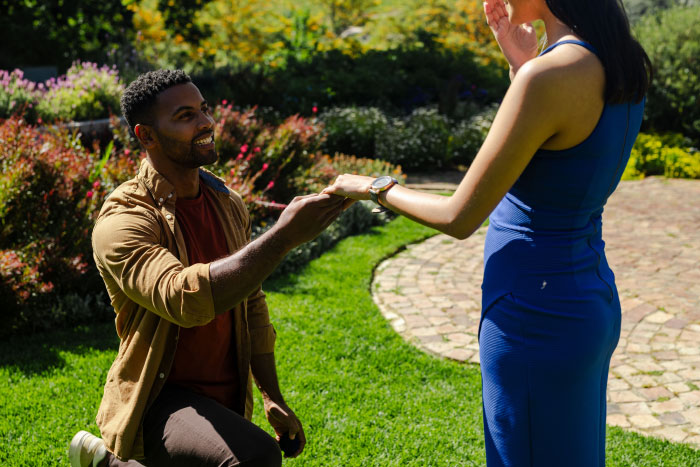 A man proposing to a woman in a garden. People tell their partners everything but will never tell these things.
