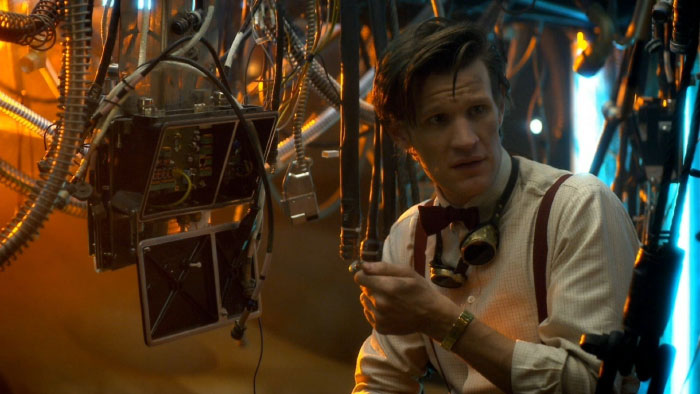 A man with goggles around his neck, surrounded by intricate machinery, showing things people never tell their partners.